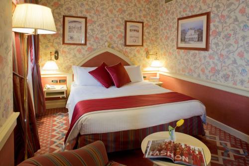 Ένα ή περισσότερα κρεβάτια σε δωμάτιο στο Hotel Milano Regency