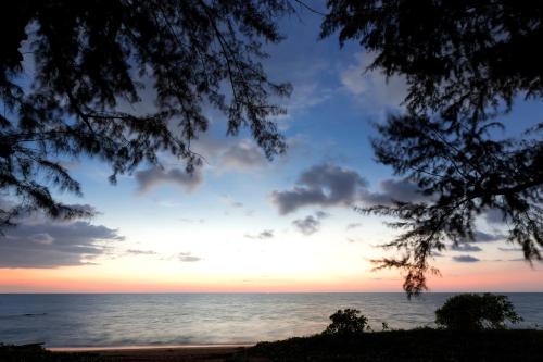 a view of the ocean at sunset at X10 Khaolak Resort in Khao Lak