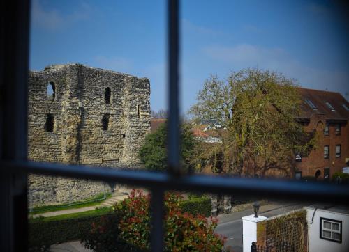 a view of a castle from a window at Castle House Hotel in Canterbury