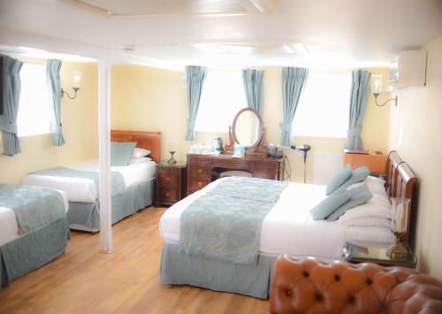 Säng eller sängar i ett rum på Castle House Hotel