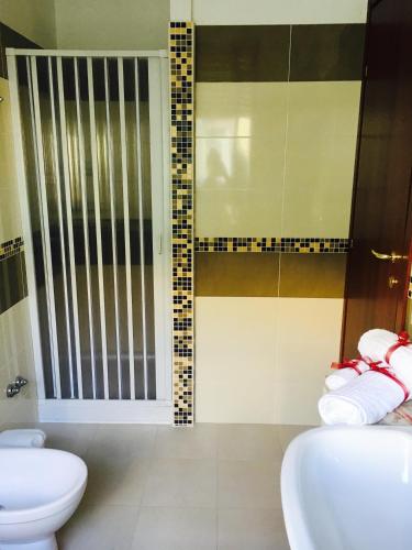a bathroom with a toilet and a sink and a shower at B&B Lo Scrigno in Vasto