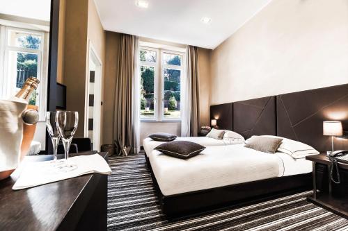 Postel nebo postele na pokoji v ubytování Hotel Principe Di Torino