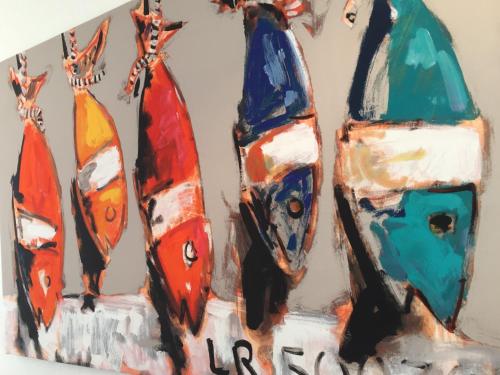 a painting of four surfboards on a wall at Face aux Flots in La Cotinière