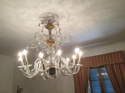 a chandelier hanging from a ceiling in a room at Villa Il Padule in Bagno a Ripoli