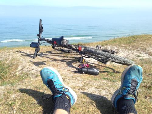 a person with their feet up next to a bike at Idrætscenter Jammerbugt in Fjerritslev