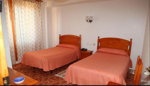 Katil atau katil-katil dalam bilik di Hotel Los Arcos