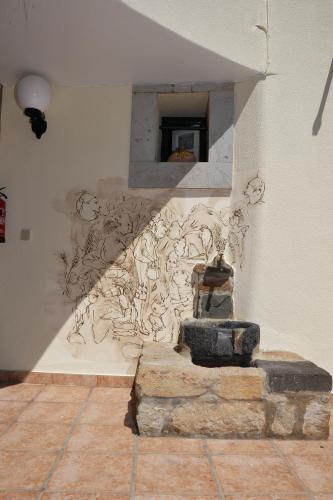 a painting on the wall of a room at 16 Porto Santo Apartments in Porto Santo