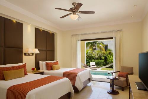 Postel nebo postele na pokoji v ubytování Dreams Tulum Resort & Spa