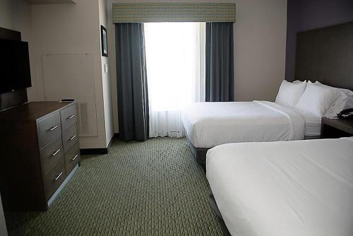 a hotel room with two beds and a window at Holiday Inn Express Hotel and Suites Port Aransas/Beach Area by IHG in Port Aransas
