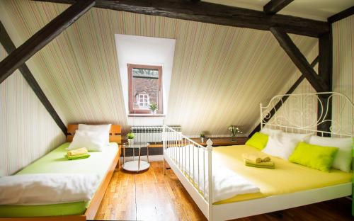 Postel nebo postele na pokoji v ubytování Hostel Centar