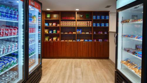 a store aisle with shelves of food and drinks at Best Western Fort Myers Inn and Suites in Fort Myers