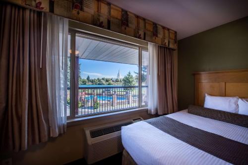 Ένα ή περισσότερα κρεβάτια σε δωμάτιο στο Best Western Driftwood Inn