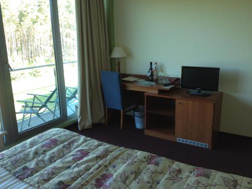 Postel nebo postele na pokoji v ubytování Meduza Hotel