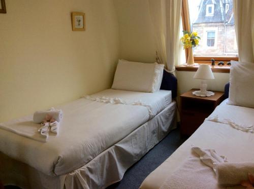 Postel nebo postele na pokoji v ubytování Connel Court Apartments