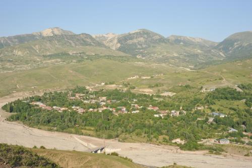 a small town in a valley in the mountains at Ancient Lahij Guest House in Lahıc