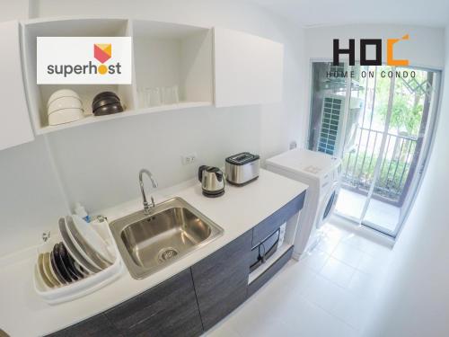 a kitchen with a sink and a counter top at HOC2 Apartment Santitham Chiang Mai in Chiang Mai