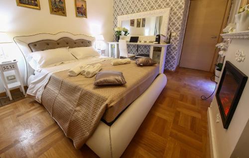a bedroom with a bed with two pillows on it at Barberini Dream in Rome