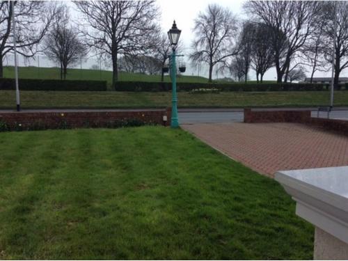 a green light pole in a park with grass at Alma Lodge Guest House in Plymouth