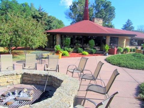 a group of chairs sitting around a fire pit at Spring Valley Inn in Spring Green