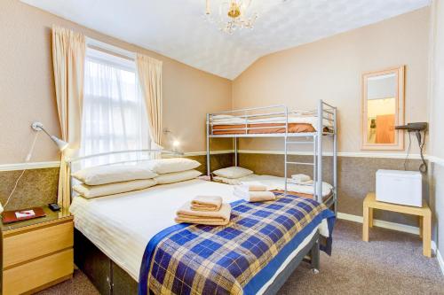 a bedroom with a bunk bed and a window at New Brooklyn in Blackpool