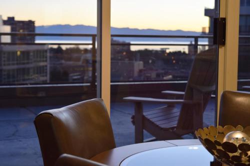 a view of a balcony with a table and chairs at Chateau Victoria Hotel & Suites in Victoria