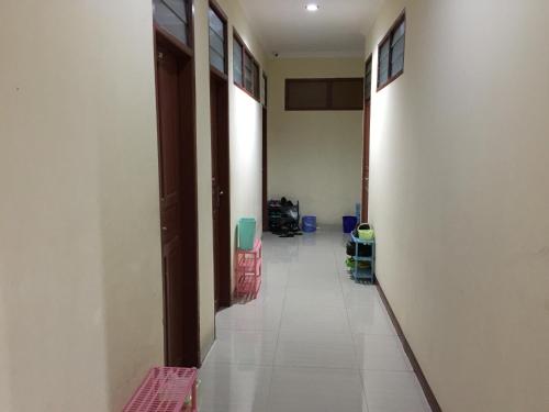 an empty hallway with a room with a hallway at Wisma Mawas in Makassar