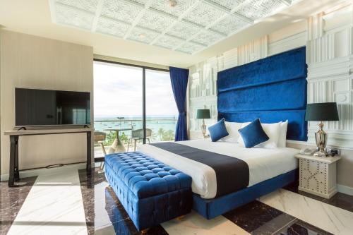 Postel nebo postele na pokoji v ubytování Mera Mare Pattaya