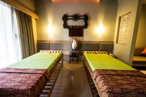 Katil atau katil-katil dalam bilik di Tetirah Boutique Hotel
