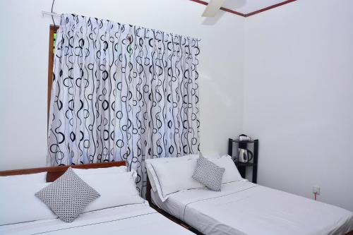 Postel nebo postele na pokoji v ubytování Livinginn Polonnaruwa