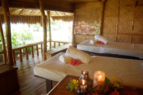 Postel nebo postele na pokoji v ubytování Hijo Resorts Davao