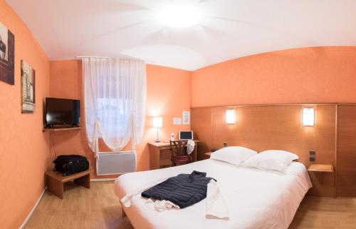 Postel nebo postele na pokoji v ubytování Hotel Spa Le Relais Des Moines