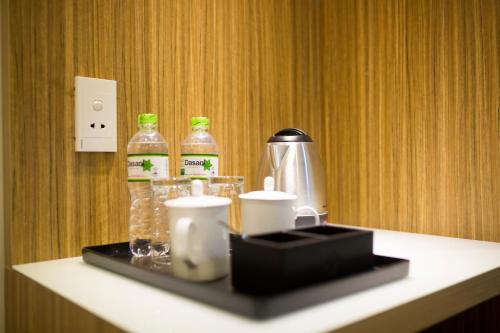 a counter with two bottles of water on top of it at Red Palace Hotel in Da Nang