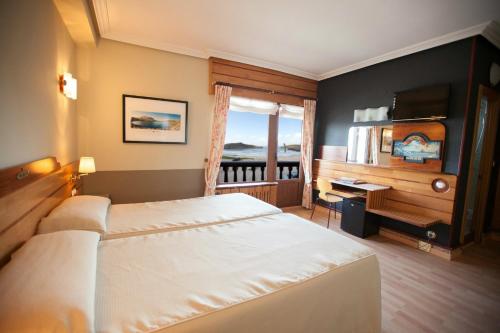 Katil atau katil-katil dalam bilik di Hotel Kaype - Quintamar