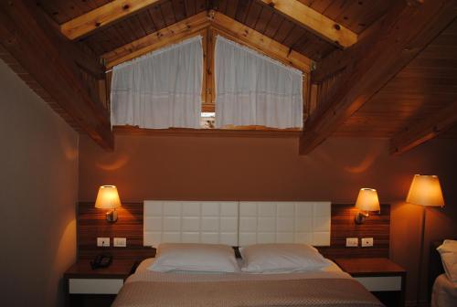 Postel nebo postele na pokoji v ubytování Hotel Vila 60