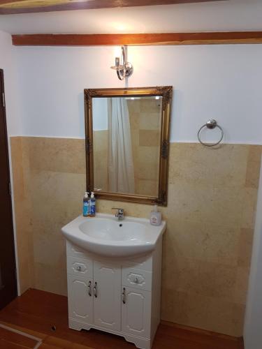 a bathroom with a sink and a mirror at Bucharest Boutique Accommodation by Hotels in Bucharest
