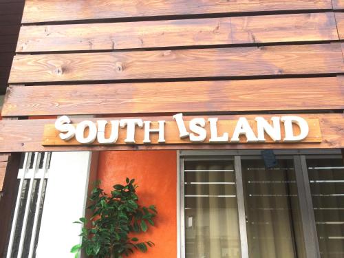 a south island sign on the front of a building at South Island in Itoman