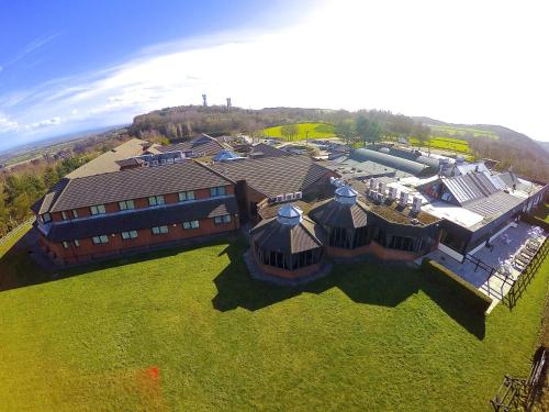 an aerial view of a large house with a roof at Best Western Frodsham Forest Hills Hotel in Frodsham