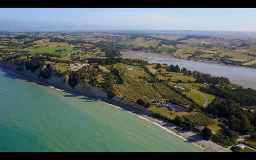 an aerial view of a river with trees and water at Windhover Suites in Tasman
