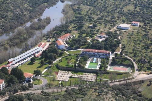 an aerial view of a school with a river at Balneario de Ledesma in Vega de Tirados