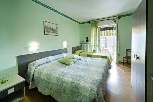 A bed or beds in a room at Albergo Mancuso del Voison