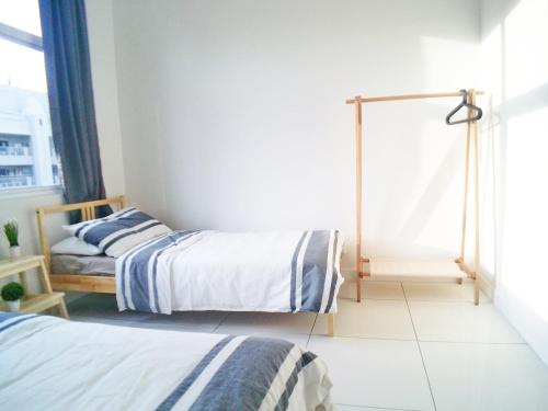 No.1 The Muji @ Puchong Skypod Residenceにあるベッド