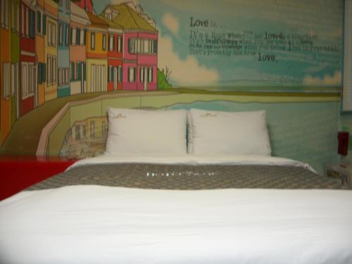 Postel nebo postele na pokoji v ubytování Songdo Blue Hotel