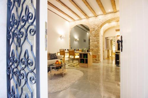 a living room and a dining room with a table at Dalti Center Apartment in Zadar