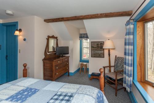 Ένα ή περισσότερα κρεβάτια σε δωμάτιο στο Inn at Buck Hollow Farm