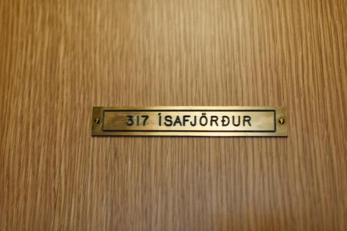 a sign that reads st katharine on a wooden wall at Student Hostel in Reykjavík