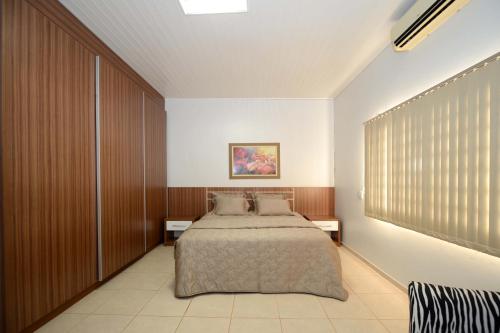 Tempat tidur dalam kamar di Pousada Haras Santa Rita