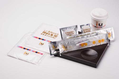 a kiosk with a cup of coffee and a drink at IU Hotel Xian Zhonggulou Square in Xi'an