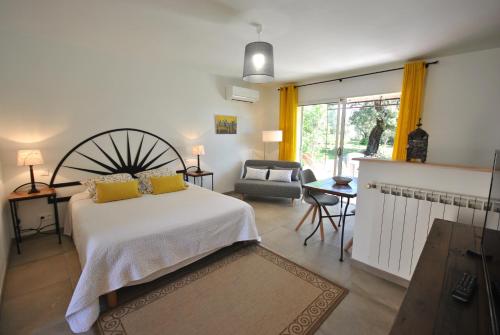 Postel nebo postele na pokoji v ubytování B&B La Badelle
