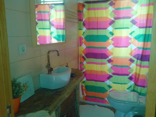 a bathroom with a sink and a shower curtain at Casas Botelho Elias in Pinhão