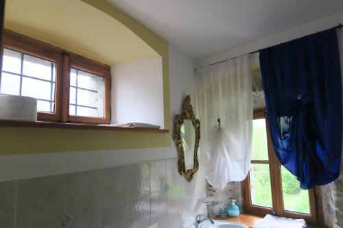 a bathroom with a sink and a window at Rooms Alpe Veglia-Varzo in Varzo